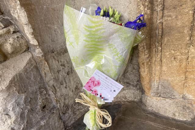 Bunches of flowers had been left at the entrance of All Saints Church.