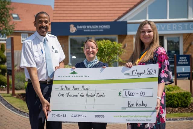 DWSM - SGB-2053 - Fitzroy and Kate of DWH handing the cheque to Ilze at The Never Alone Project