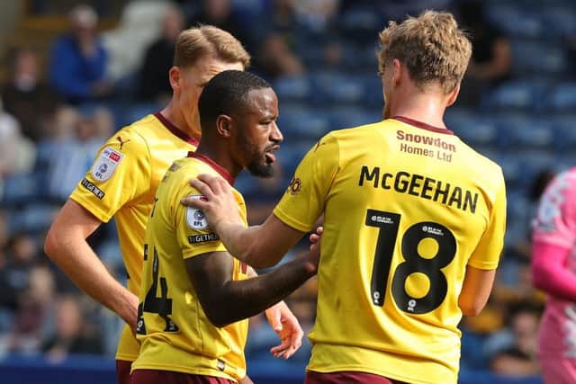 Tariqe Fosu got his Cobblers account up and running against Huddersfield