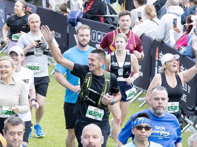 Hundreds of runners braved showers and wind to take on the race on Sunday (May 25), which started and finished at Sixfields stadium.