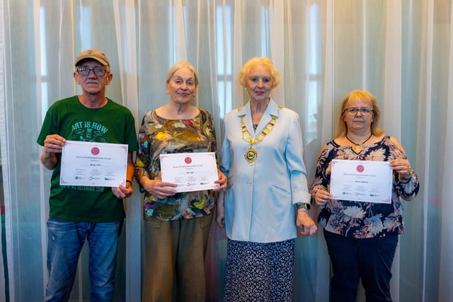 Councillor Barbara Jenney from North Northants Council presenting George Hill and Kate Dyer from the KHL Community Workshop, and Nicola Stanton from Jorgie's Buddies, with their Rose of Northamptonshire Awards.
•	George Hill supports countless community activities in Corby, Kingswood and Hazel Leys, volunteering for the KHL Big Local Community Trust and dedicating his time to organise events such as the annual Field Day Festival. 
•	Kate Dyer volunteers for the Friends of Kingswood and the Corby Kingswood and Hazel Leys Community Workshop, welcoming the local community to join a range of creative projects
•	Nicola Stanton founded a Be Brave Bears project, providing the bears to children with life limiting, life threatening or lifechanging conditions. Over 1,000 bears have been sponsored in Northamptonshire.