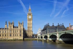 The Big Ben and Palace of Westminster under a clear blue London sky.