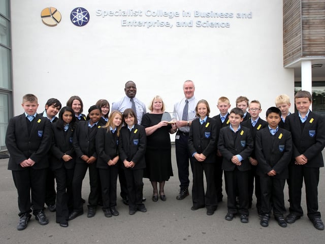 2009: Pupils from Duston School being presented with a national education award for their World Environment Day project.  Pictured: Lameck Sithole, standards manager from Laddaw Limited and Andrew Butler, safety, health and facilities manager from Laddaw Limited presenting the award to Maureen Raine, deputy head and pupils.