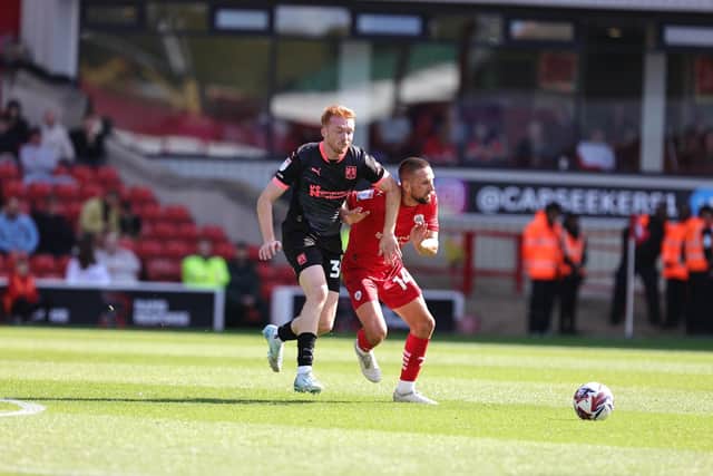 Callum Morton battles with Barnsley's Conor Hourihane during Saturday's League One game. Picture: Pete Norton