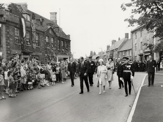 The Queen and Duke of Edinburgh walk through Higham Ferrers during their trip to Northamptonshire on July 9, 1965