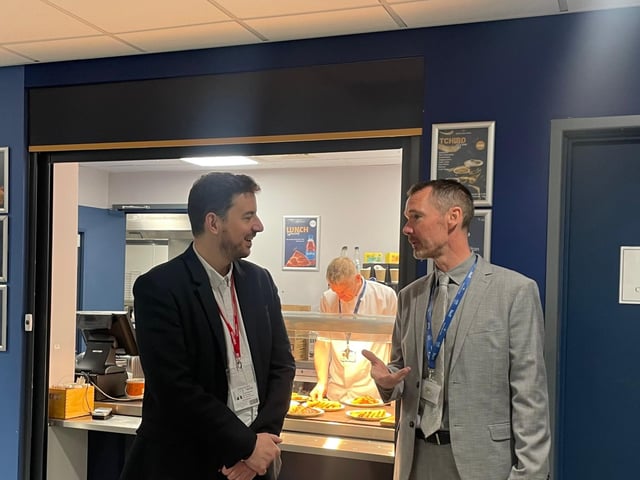 Mike Reader MP discussing the benefits of free breakfast clubs with Wootton Park School Principle and CEO Dan Rosser