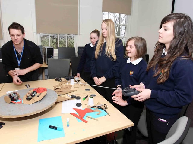 Year 8 pupils from across Northamptonshire attending The University of Northampton for a 'Girls into Engineering' event. Pictured: Pupils from Montsaye Community College taking part in a Roaming Robots workshop.