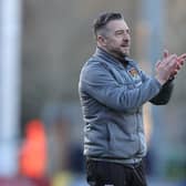 Jon Brady applauds the travelling fans at the end of  the Sky Bet League One match between Burton Albion and Northampton Town