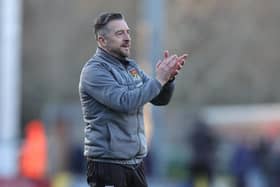 Jon Brady applauds the travelling fans at the end of  the Sky Bet League One match between Burton Albion and Northampton Town