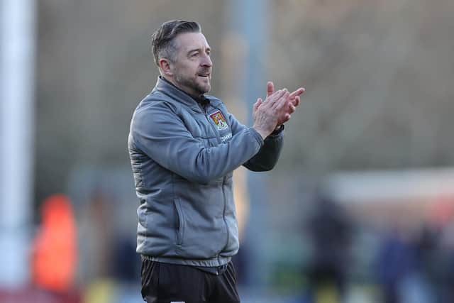 Jon Brady applauds the travelling fans at the end of the Sky Bet League One match between Burton Albion and Northampton Town