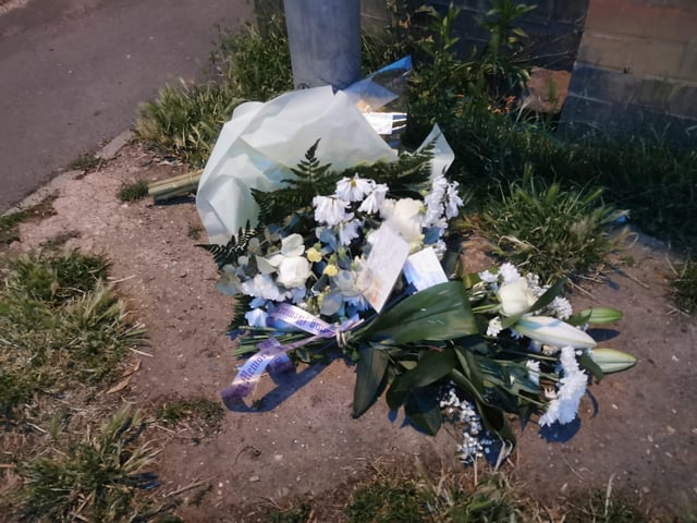 Several floral arrangements and notes were left at the scene in Semilong park after the fatal stabbing on Thursday July 18.