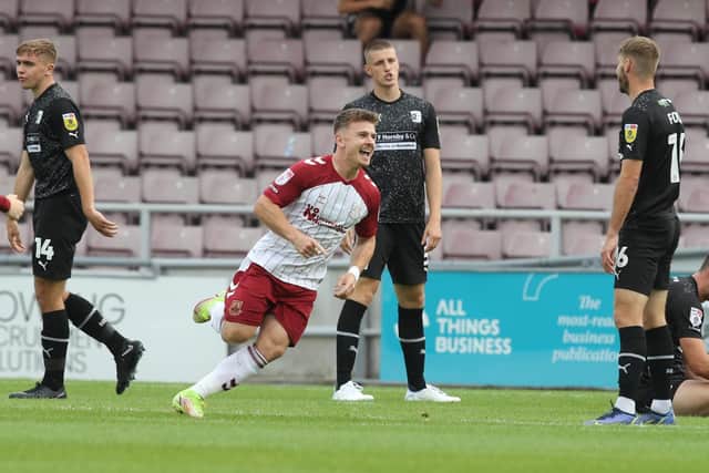 Sam Hoskins celebrates after firing the Cobblers into a 1-0 lead against Barrow at Sixfields (Picture: Pete Norton)