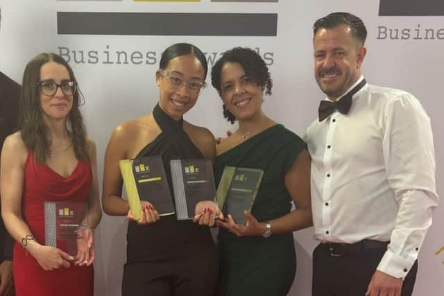 Proaction accepting their awards.