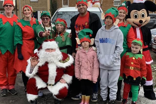Local Councillors James Hill, Paul Clark (Father Christmas) and Ecton Brook Residents Group.