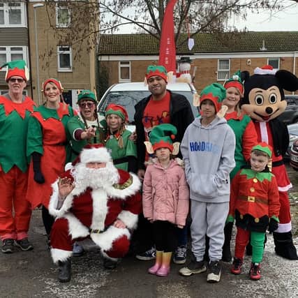 Local Councillors James Hill, Paul Clark (Father Christmas) and Ecton Brook Residents Group.