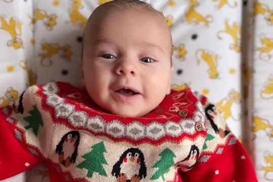11-week-old Leo celebrating his first Christmas.