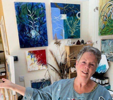 Artist Annette Sykes with her work