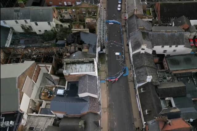 Drone footage shows the state of Bridge Street on December 29. On the left is the fire-ravaged former Fat Cats site.
