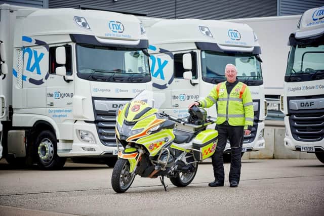 Delivering for the community, NX driver and Warwickshire and Solihull Blood Bikes volunteer, Alan Knight prepares to take on fundraising challenge