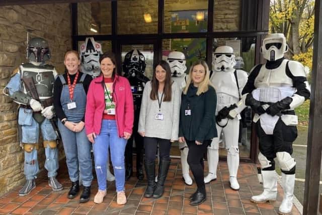 Some of the KidsAid staff with Star Wars characters, which others could also be pictured with at their Christmas fair in aid of the Big Give campaign.