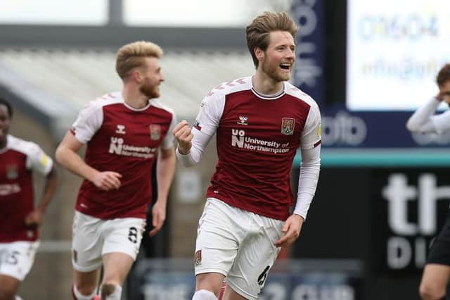 Ryan Watson celebrates one of his two goals during Northampton's 4-1 win over Portsmouth the last time the two teams met.