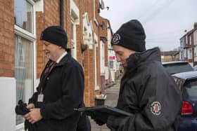 Protection officers from Northamptonshire Fire and Rescue Service hand out advice to a homeowner.