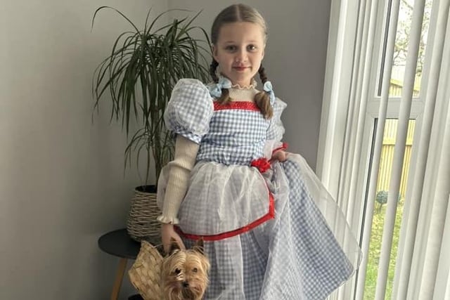Dorothy and real life Toto - Amaya-Grace aged 9 with dog Ralph.