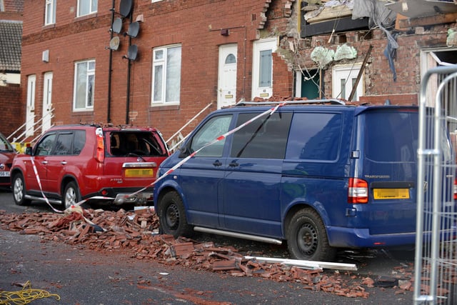 Cars and other properties in the street were damaged following the blast.