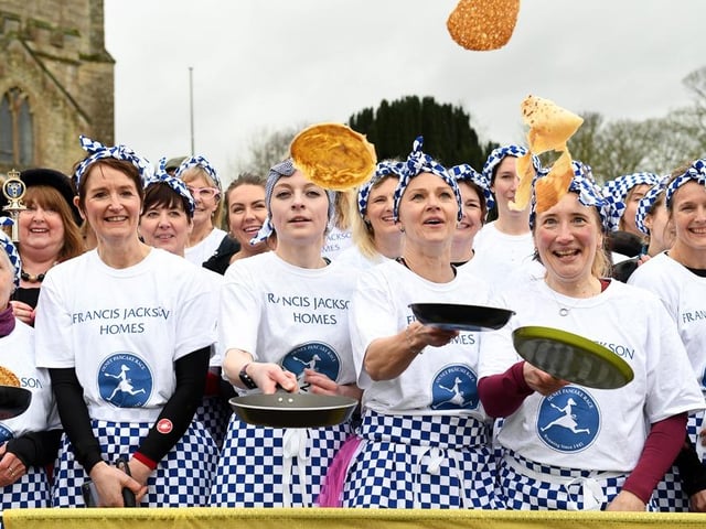 The ladies had to remember to toss their pancakes as they ran