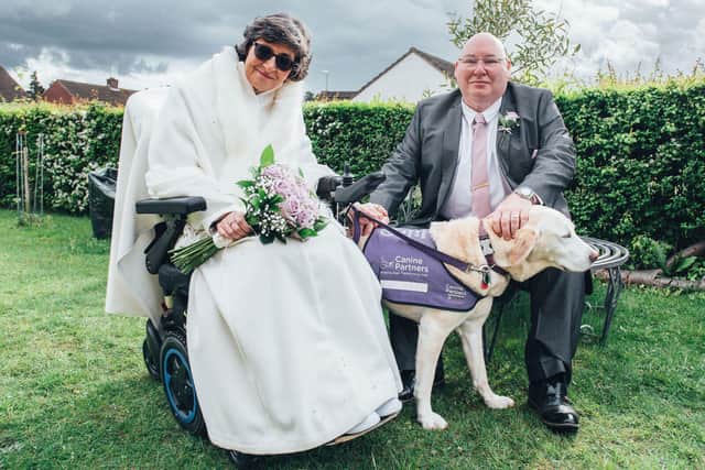 Martha the assistance dog with newlyweds Tracey and Martin