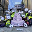 Campaigners “celebrated” with music, party hats and a giant “21 Years of Toxic Air” cake.