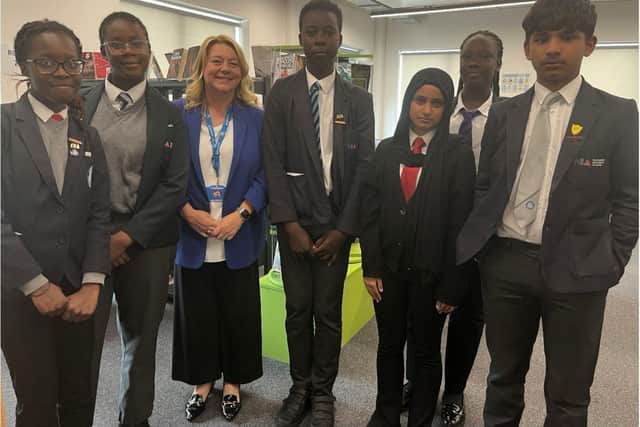 Julie Broadbent with students at Northampton International Academy Library