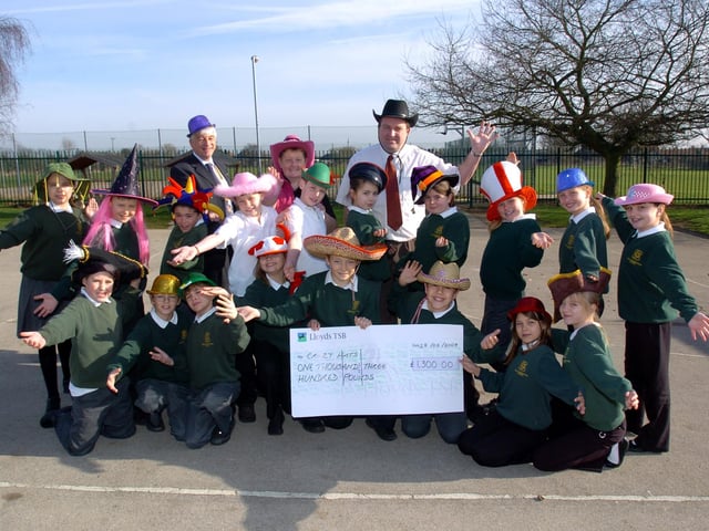 Great Doddington, Primary School, £ to Crazy Hats with Rotary. With Year 6 students. l-r John Saynor (Northampton Becket Rotary Club), Glennis Hooper (Crazy Hats) and Daryl Gunn (class teacher)