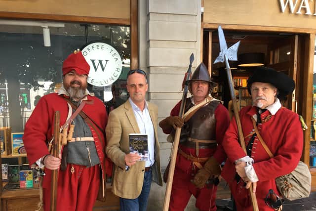Author Charles Cordell and English Civil War re-enactors outside a Waterstones bookshop
