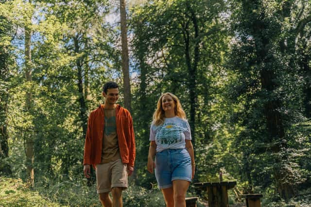 Two people walking in a Forestry England woodland