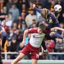 Keiron Bowie battles for an aerial ball during the defeat to Bradford City (Picture: Pete Norton)