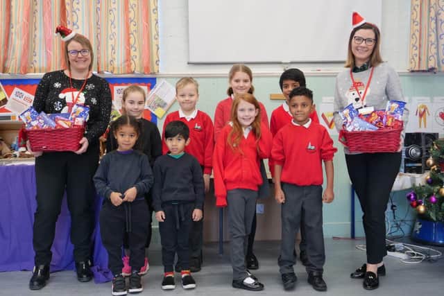 Pictured from left to right: Stacey Groom and Estelle Douglas from Matthew Oliver Windows & Doors with pupils at Wilby CE Primary School.