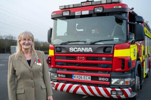 Cyndy 'Cyd' Phillips with the newly named fire engine /NFRS