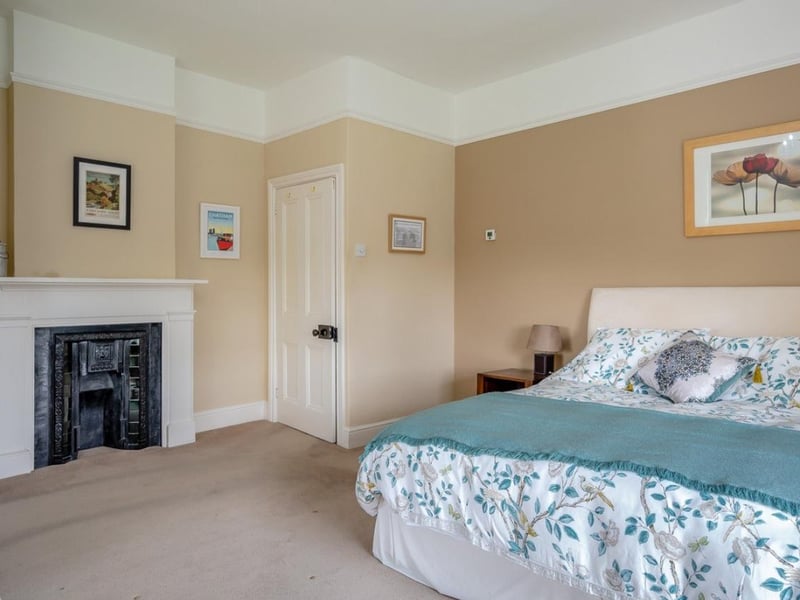 And here's one of the smaller bedrooms, with an original fireplace