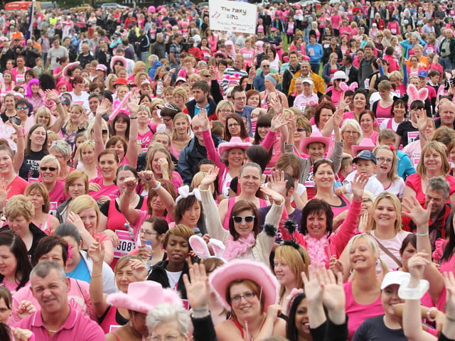2011 - Over four thousand women warm up before the start in the 5k Race for Life at Abington Park in Northampton.