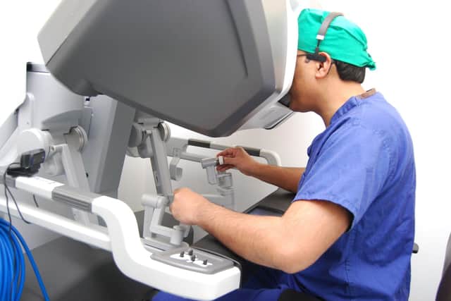 Mr Jamil Ahmed, UHN’s Deputy Director of Medical Education and a consultant colorectal and lead for robotic colorectal surgery, performing surgery using the robot controls.