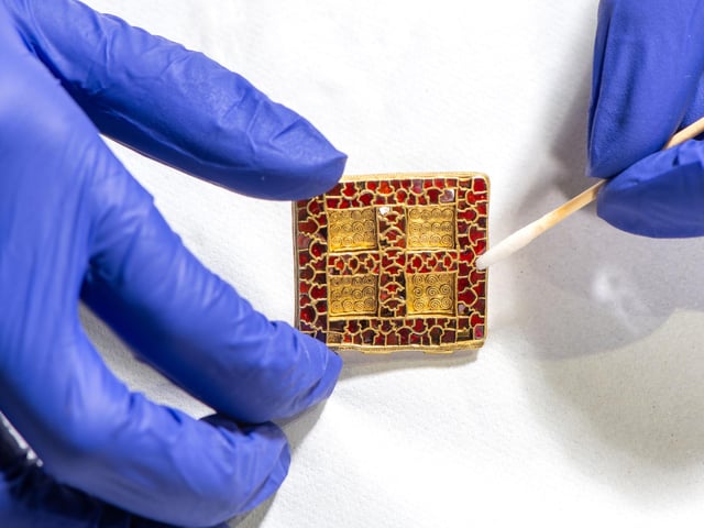 Cleaning central pendant from Harpole Burial necklace