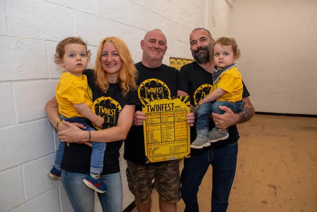 Twinfest organisers with one of this year's posters.
