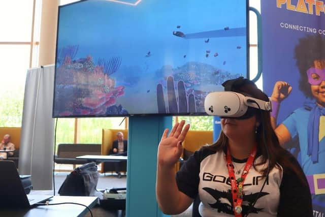 Testing out the virtual reality headsets at technology innovation event, Merged Futures.