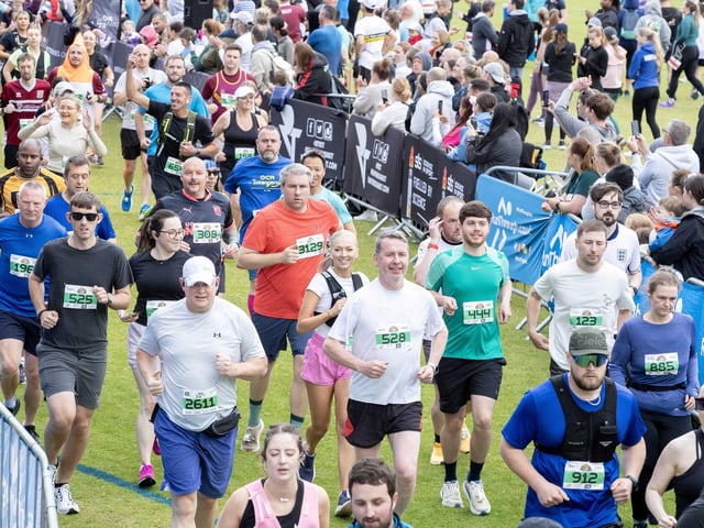 Hundreds of runners braved showers and wind to take on the race on Sunday (May 25), which started and finished at Sixfields stadium.