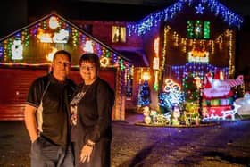 Melanie and Nick Phipps outside their home in Vienne Close during the festive season in 2019.