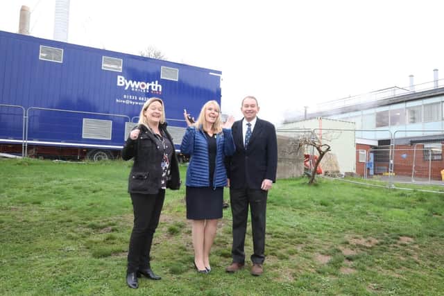 L-r Kettering General Hospital’s Director of Strategy Polly Grimmett, Hospital Chief Executive Deborah Needham, Kettering MP Philip Hollobone in front of the temporary boilers