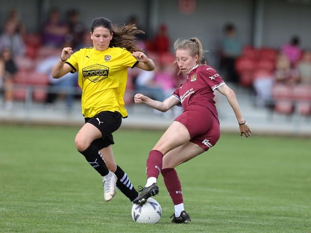 Fay Noble drags the ball away from Lily Stevenson