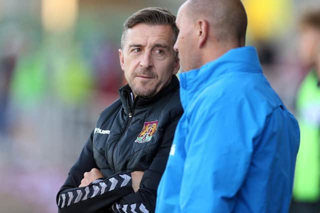 Jon Brady and Burton manager Mark Robinson are friends off the pitch