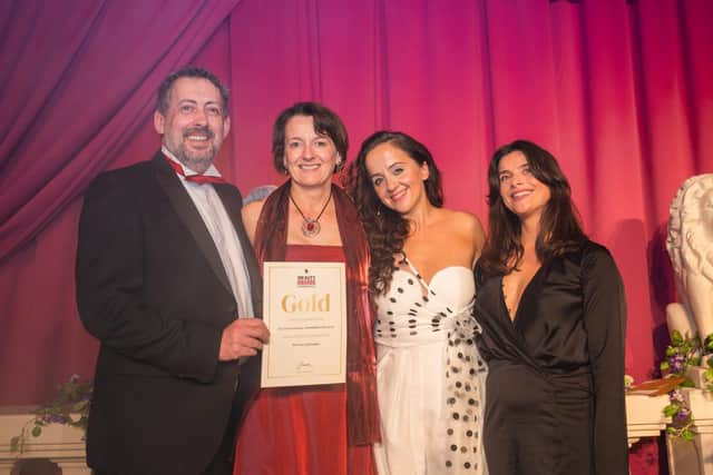 James and Michelle Sutton receiving award from Luisa Omielan at the Pure Beauty Awards